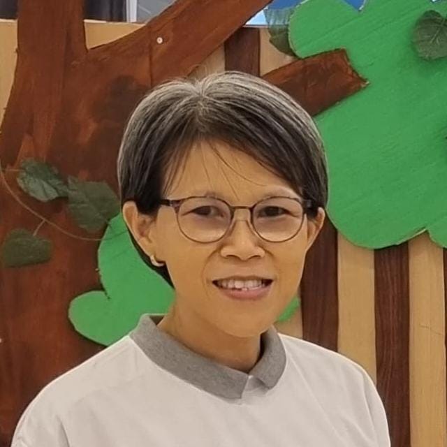 Tjong Wenly, S,Pd.B, S.Pd.SD.Gr, M.M.